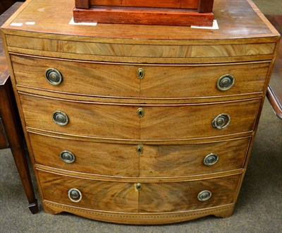 Lot 1313 - A 19th century crossbanded mahogany bow fronted four height chest of drawers