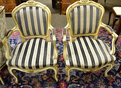 Lot 1317 - A pair of painted parcel-gilt Louis XV style fauteuils