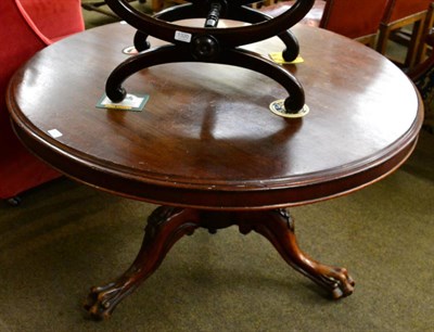 Lot 1321 - A 19th century mahogany circular pedestal table raised on paw feet