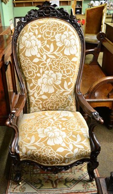 Lot 1324 - A Victorian gents carved armchair of large proportions