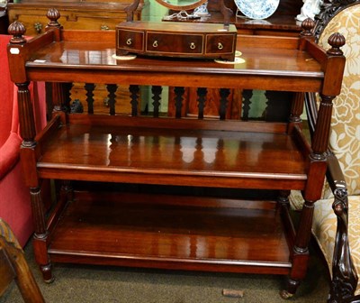 Lot 1329 - A William IV/Victorian mahogany three tier buffet, on fluted supports and castors