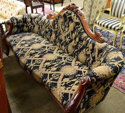 Lot 1330 - A Victorian carved mahogany sofa, with buttoned back