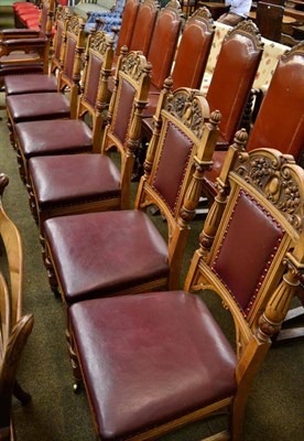 Lot 1333 - A set of seven carved oak boardroom chairs including one armchair, the armchair bearing label...