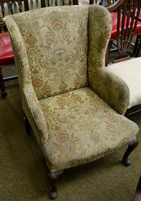 Lot 1348 - A Georgian style mahogany framed wing chair