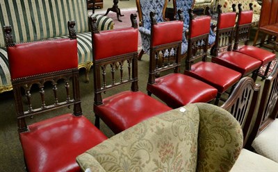 Lot 1349 - A set of six studded red leather and carved oak dining chairs