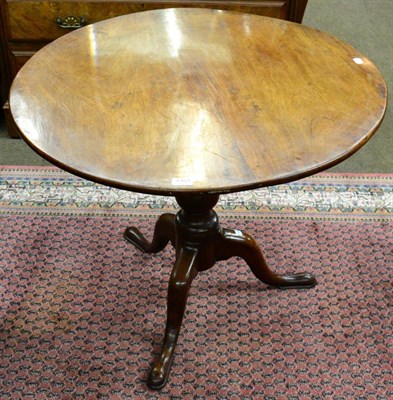 Lot 1353 - A George III mahogany tilt top tripod table