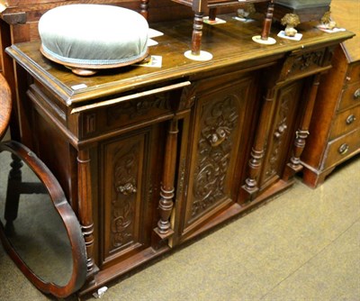 Lot 1376 - A 19th century and later French carved walnut three door side cabinet