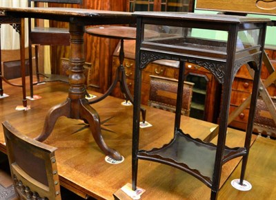 Lot 1378 - A George III oak tilt top tripod table and a later bijouterie cabinet