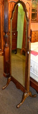 Lot 1383 - A walnut framed cheval mirror