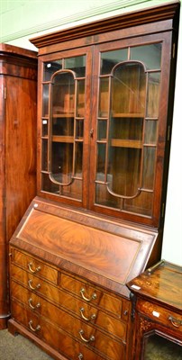 Lot 1386 - A glazed mahogany bureau bookcase