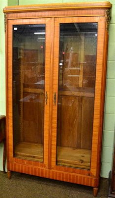 Lot 1391 - A French glazed bookcase with adjustable shelves