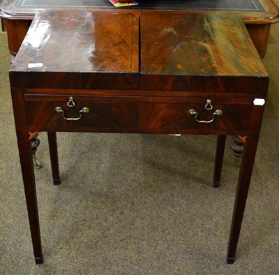 Lot 1396 - A George III mahogany and ebony strung dressing table, circa 1800, with hinged lid above a pull-out