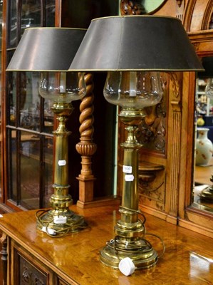 Lot 1406 - A pair of reproduction brass table lamps with glass and card shades in the form of converted...