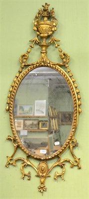 Lot 1409 - A George III gilt and gesso oval pier glass, late 18th century, the rope twist frame surmounted...