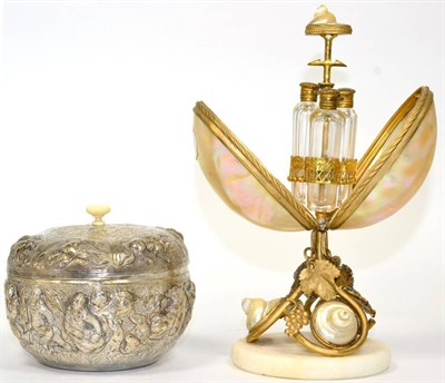Lot 11 - ~ An Indian silver bowl and cover, with an insert; and a French mother of pearl shell perfume...