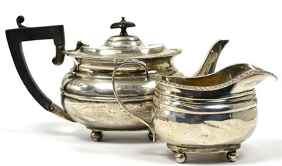 Lot 13 - A bachelors silver teapot, Goldsmiths and Silversmiths, Sheffield 1916; and a George III style...