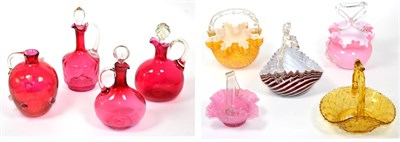 Lot 40 - ~ Four cranberry glass jugs and stoppers, together with five assorted glass baskets