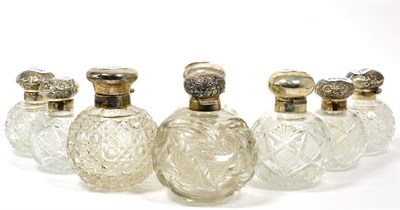 Lot 42 - ~ Eight assorted silver lidded scent bottles