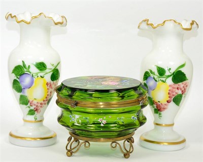 Lot 43 - ~ A Victorian enamelled green glass lidded bowl and a pair of fruit painted opaque vases