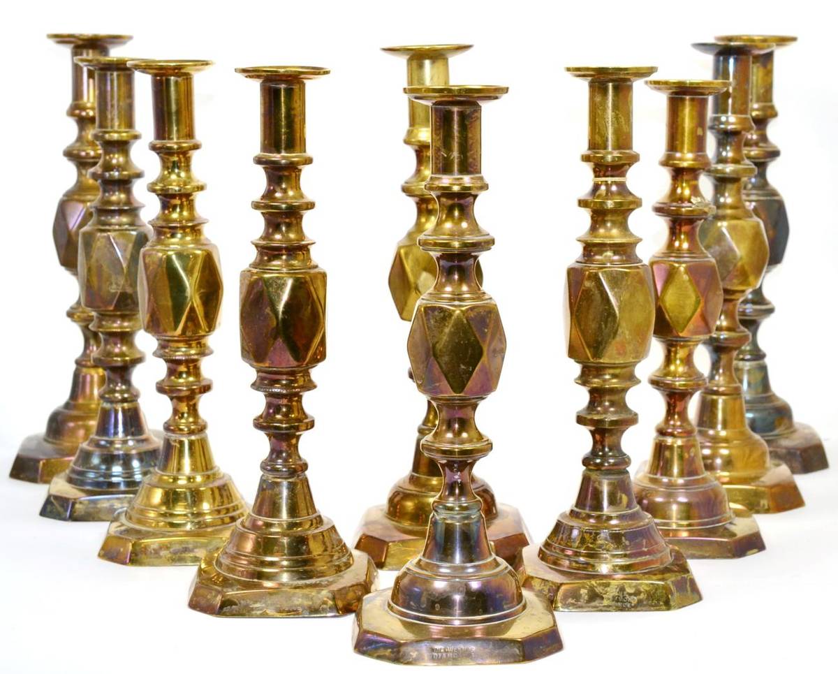 Lot 44 - ~ Five pairs of brass candlesticks