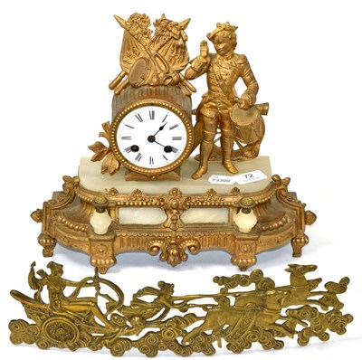 Lot 72 - ~ A French gilt metal and alabaster striking mantel clock; and an ormolu furniture mount (2)