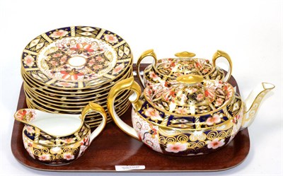 Lot 73 - ~ A Royal Crown Derby Imari teapot, cream, sugar and plates (15)