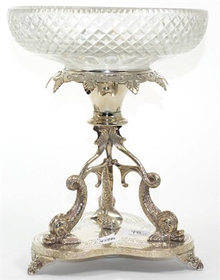 Lot 78 - ~ A silver plated centre piece with dolphin supports with glass dish