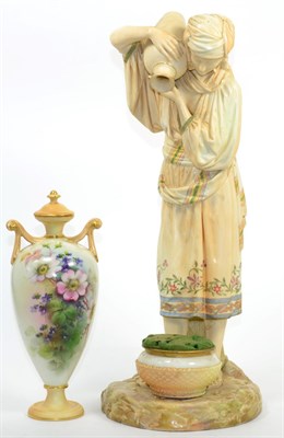 Lot 81 - A large Royal Worcester figures of a water carrier; and a Royal Worcester twin handled vase and...