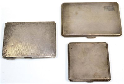 Lot 104 - Three engine turned silver cigarette cases, the largest 12.5cm long, 13.7ozt (3)