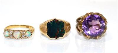 Lot 110 - A 9 carat gold bloodstone signet ring, a shield-shaped bloodstone in a rubbed over setting, to...