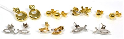 Lot 129 - Two pairs of 18 carat white gold ichthys stud earrings, two pairs of 18 carat yellow gold ball stud