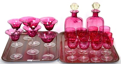 Lot 151 - ~ Pair cranberry glass flashed decanters and a quantity of cranberry glass wine glasses