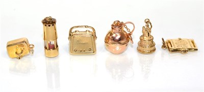 Lot 198 - Six various 9 carat gold charms, including; a lamp, a sink, a wedding cake, a handbag, a...