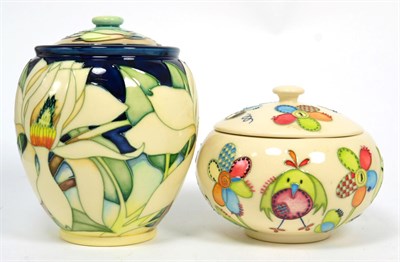 Lot 218 - A Moorcroft Nursery pattern jar and cover by Nicola Slaney, together with a Moorcorft jar and cover