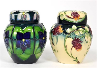 Lot 221 - A Moorcroft Violet pattern ginger jar and covers, 11cm together with a Moorcroft Meadow Charm...