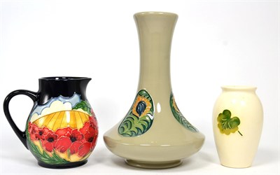 Lot 223 - A Moorcroft Forever England pattern jug, 12cm, a Moorcroft Geranium pattern vase, 10.5cm and a...