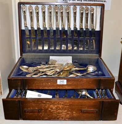 Lot 242 - ~ An oak cased canteen containing a part service American plated flatware