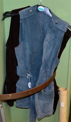 Lot 260 - Two circa late 1960's suede waistcoats with buckle belts, epaulettes to the shoulders and...