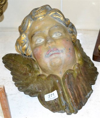 Lot 271 - ~ A painted pressed metal head of a putto