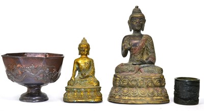 Lot 293 - A small 19th century carved brush pot, two bronze seated Buddhas and a Chinese metal pedestal cup