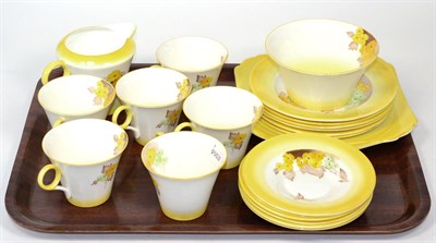 Lot 307 - A Shelley tea service, six place settings, decorated with flowers on a yellow ground