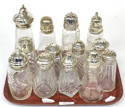 Lot 310 - Thirteen silver topped glass casters