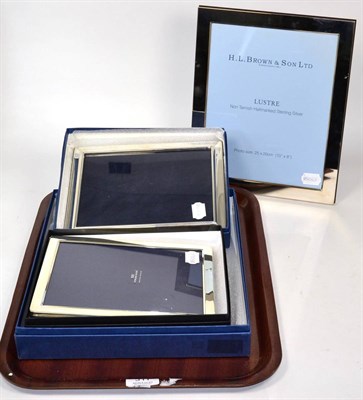 Lot 311 - One large and two smaller modern rectangular silver photograph frames, boxed and as new