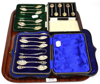 Lot 316 - Four cased sets of silver teaspoons, including a set of German examples with Maltese Cross finials