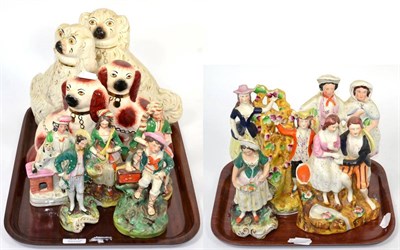 Lot 331 - A collection of Staffordshire pottery including seated spaniels and flat back figures