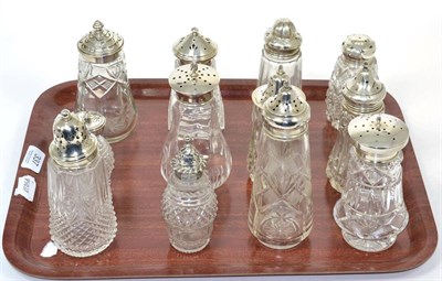 Lot 337 - Twelve silver topped glass casters