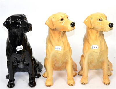 Lot 350 - Three Beswick pottery models of labradors