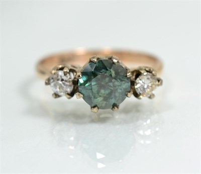 Lot 364 - A blue zircon and diamond three stone ring, a round cut blue zircon between old cut diamonds in...