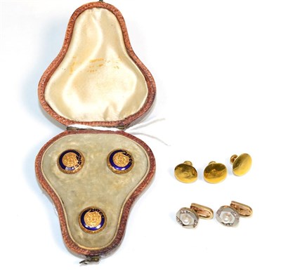 Lot 373 - A cased set of three dress studs, with blue enamel buckle decoration and foliate engraving; a...