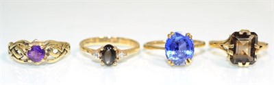 Lot 374 - A 9 carat gold sapphire ring, an oval cut sapphire in a double claw setting, to knife edge...